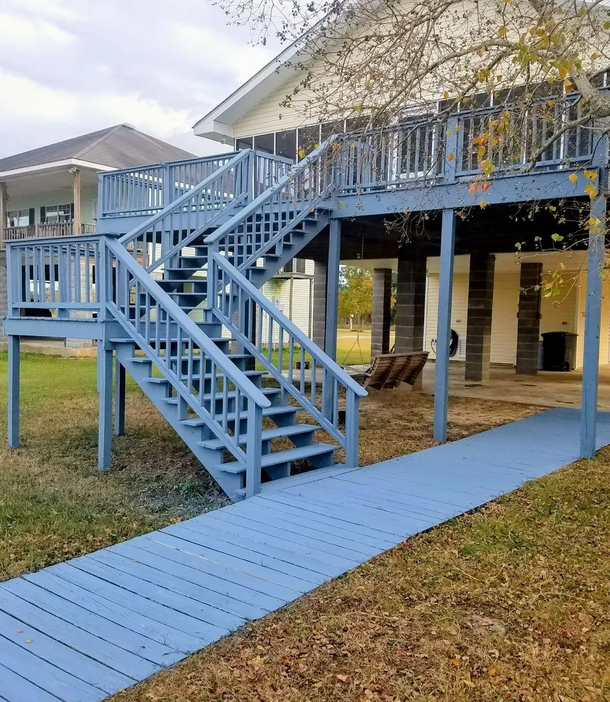House with blue-painted outdoor stairs