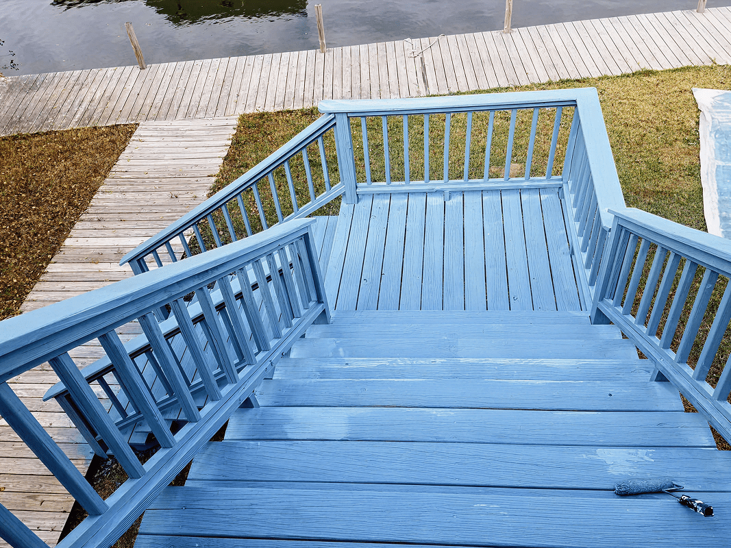 Blue stairs overlooking a waterfront area